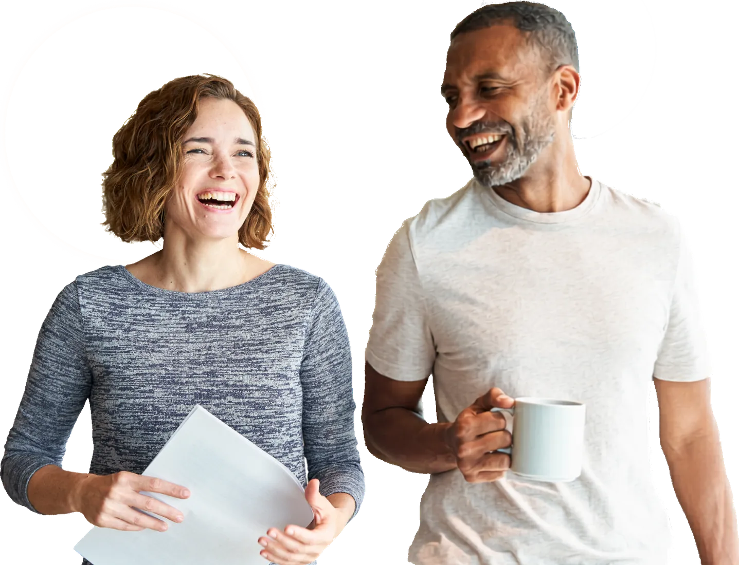 Two colleagues sharing a laugh over their notes