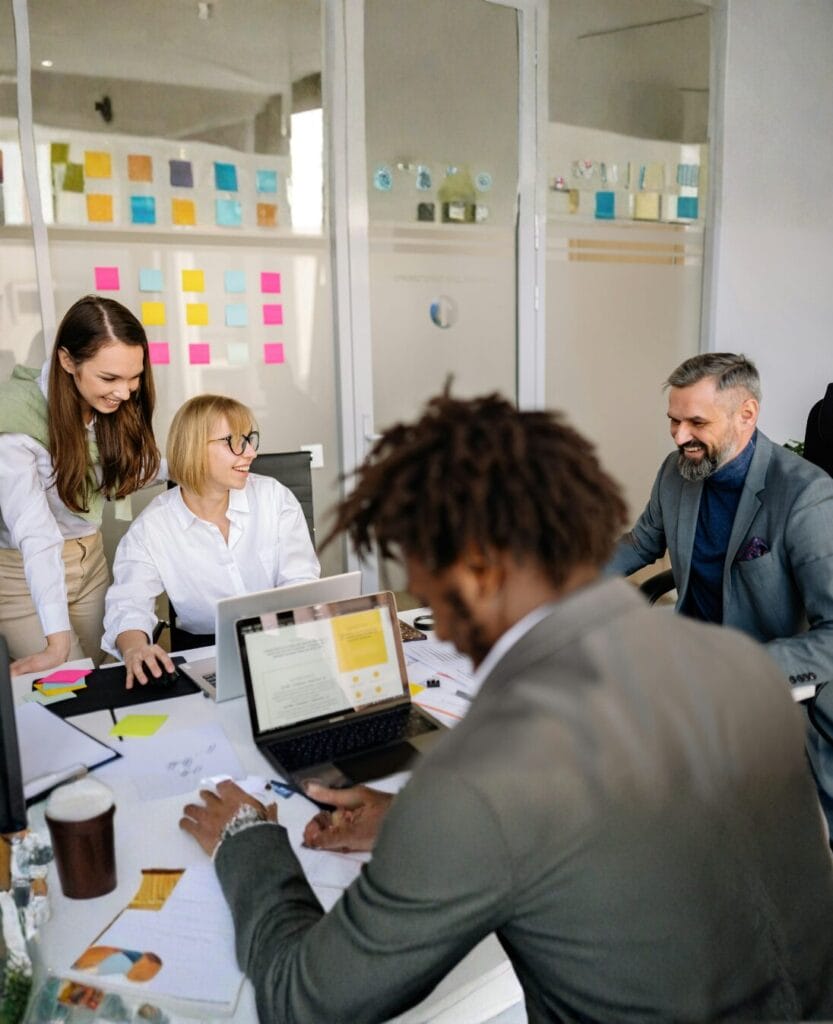 Team using DISC and emotional intelligence assessment to improve workplace communication and collaboration